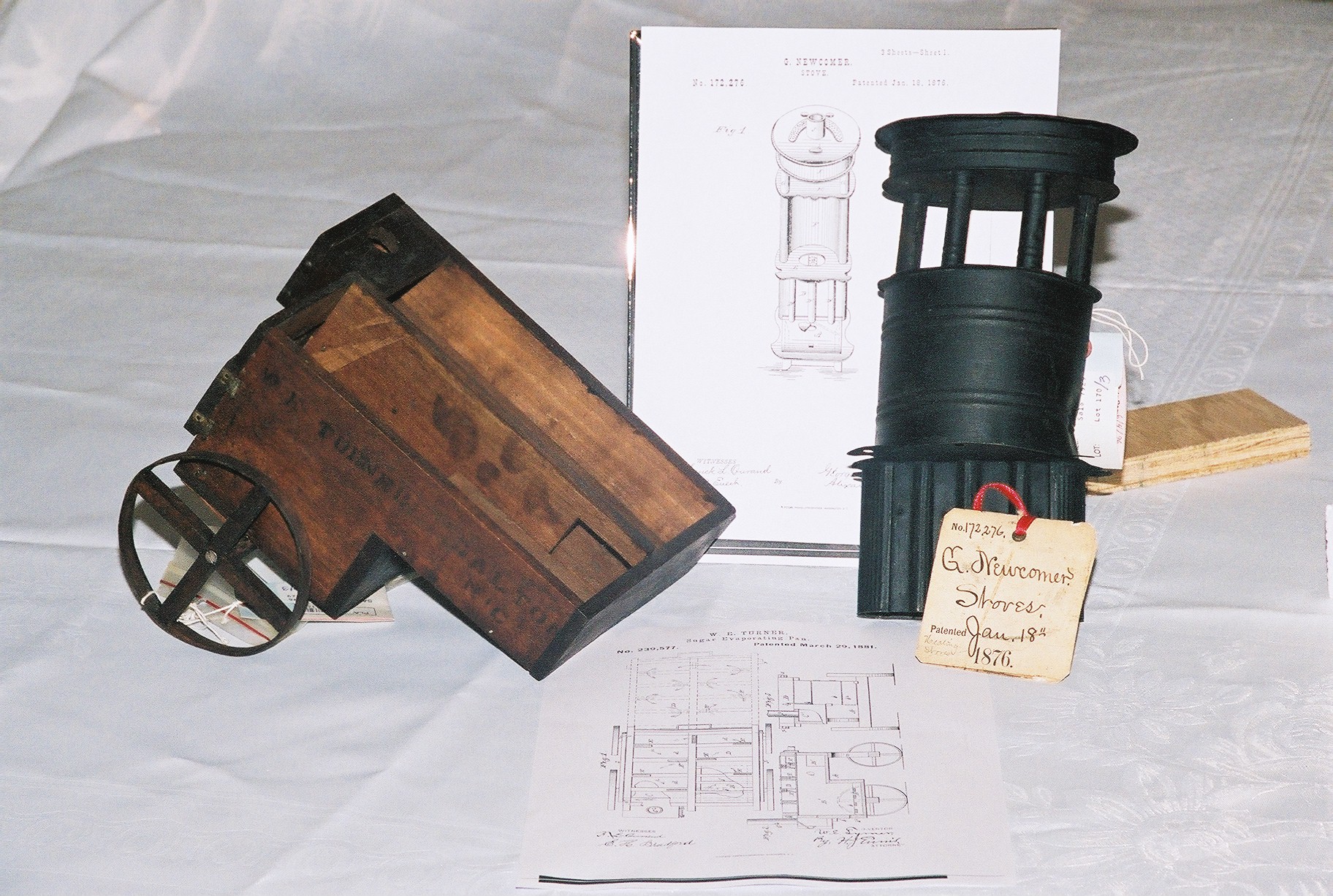 Photo of actual patent models of a sugar evaporator (left) and a stove.  Click anywhere on photo to return!